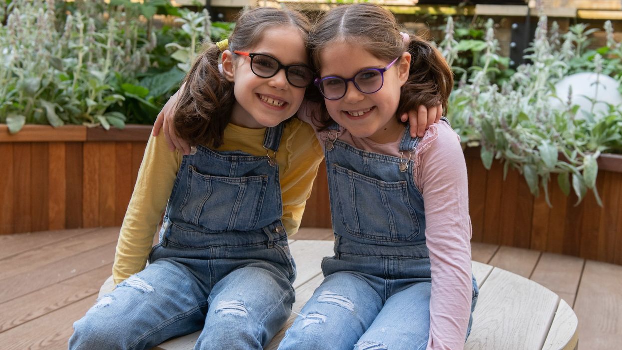 <p>1. GOSH patients Iona and Beth in the sensory garden in the Sight and Sound Centre supported by Premier Inn</p>