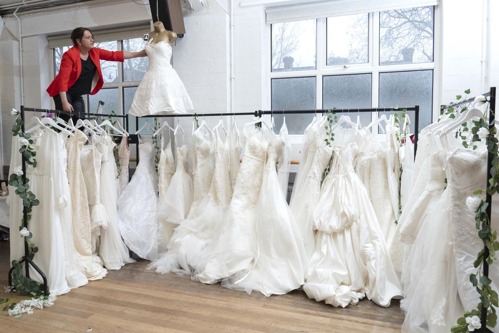 100 wedding dresses donated to charity shop in memory of late fashion designer