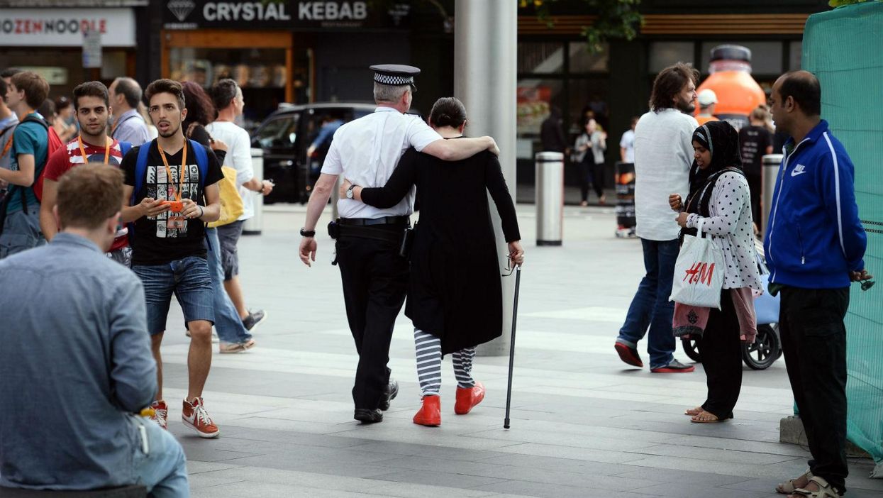 7/7 survivor Gill Hicks hugs PC Andy Maxwell, who came to her aid when she was injured at Kings Cross