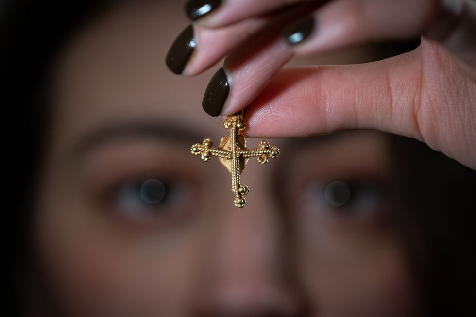 Roofer ‘over the moon’ after medieval cross sells at auction for £12,400