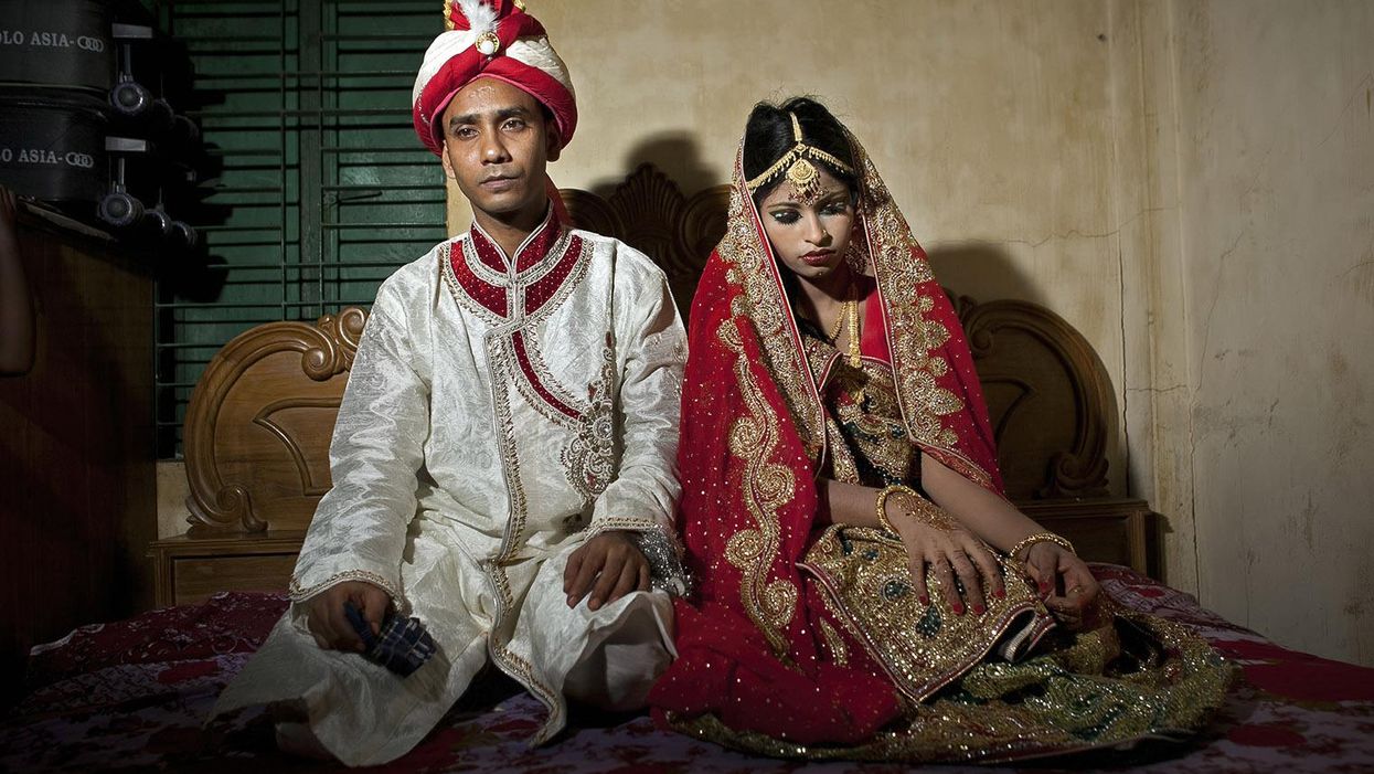 A 32 year old groom and his 15 year old bride on 20 August 2015 in Manikganj, Bangladesh
