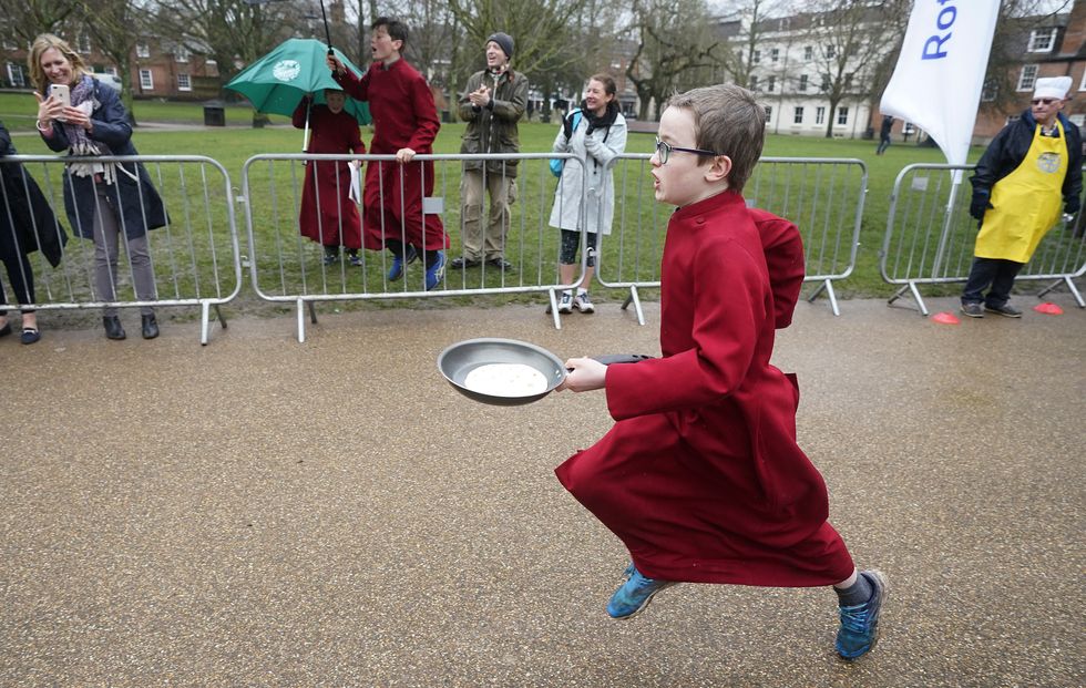 In Pictures: Pancake races and unusual ball games mark Shrove Tuesday