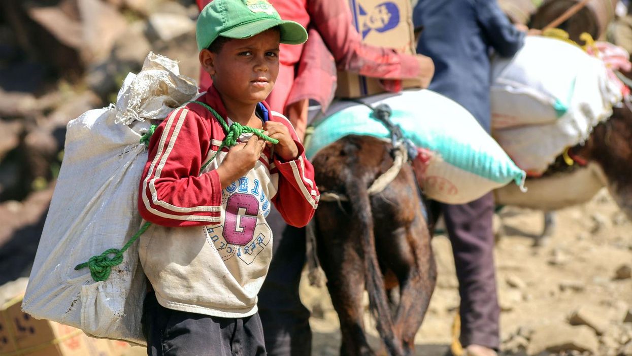 A boy walks the mountain path between Taiz and Aden on December 26th 2015. The mountain road is the only unblocked route between the cities.