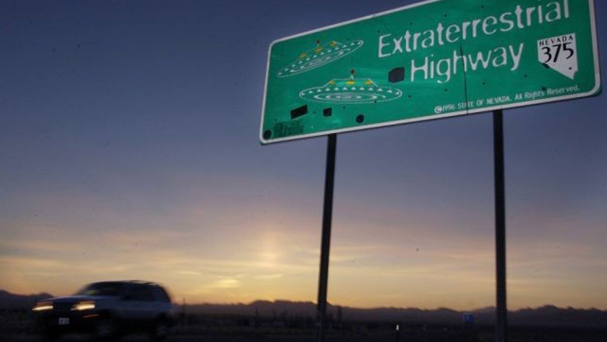 A car moves along the Extraterrestrial Highway near Rachel, Nevada, on the east side of Area 51