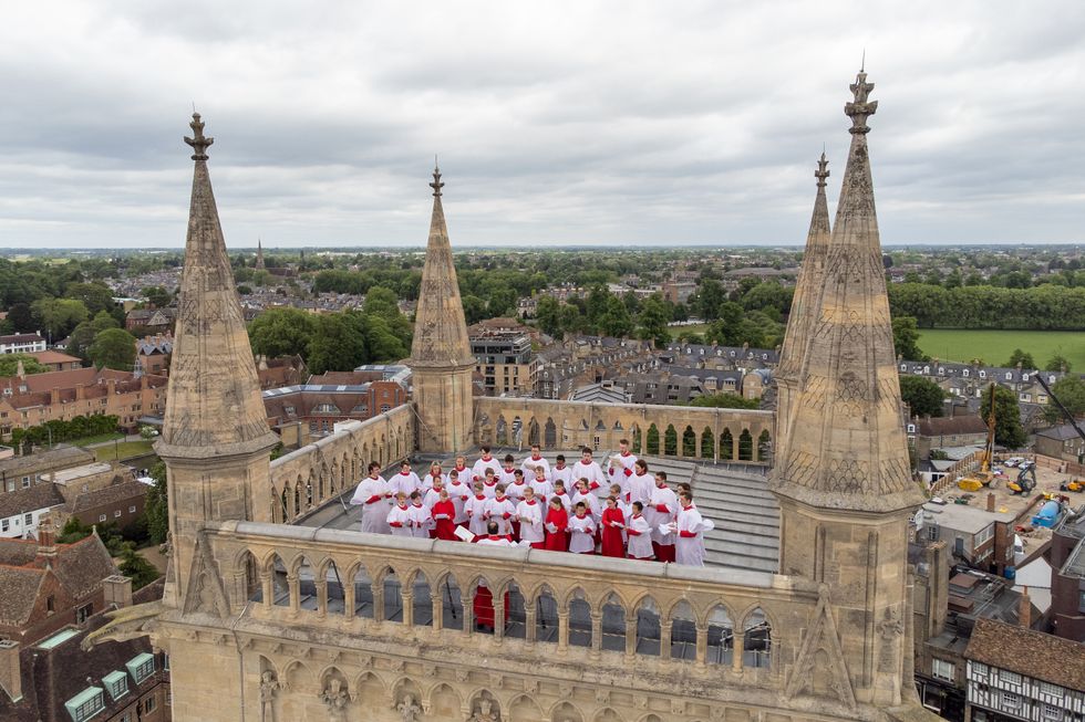 Choir sings from top of 163ft tower at Cambridge college