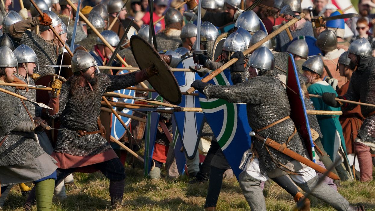 A clash during the Battle of Hastings re-enactment at Battle Abbey in Sussex (PA)