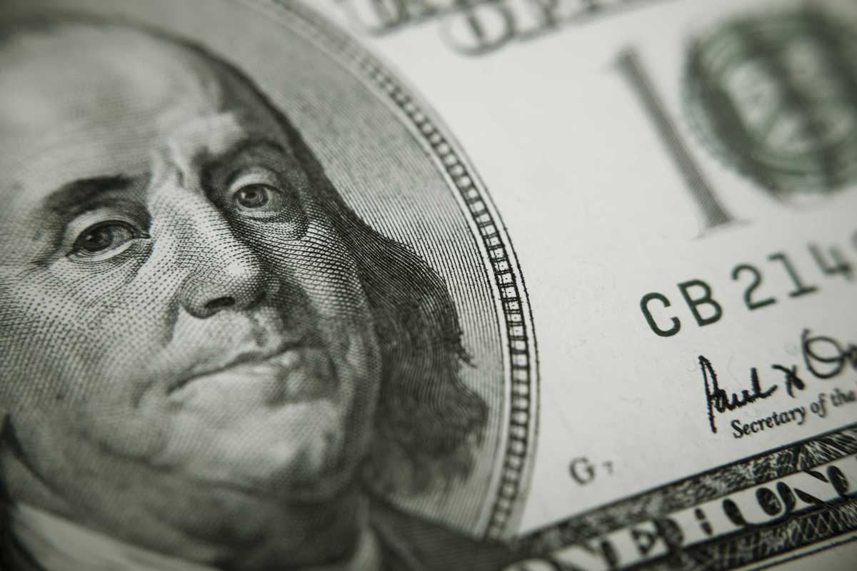 A closeup of a Benjamin Franklin $100 bill.