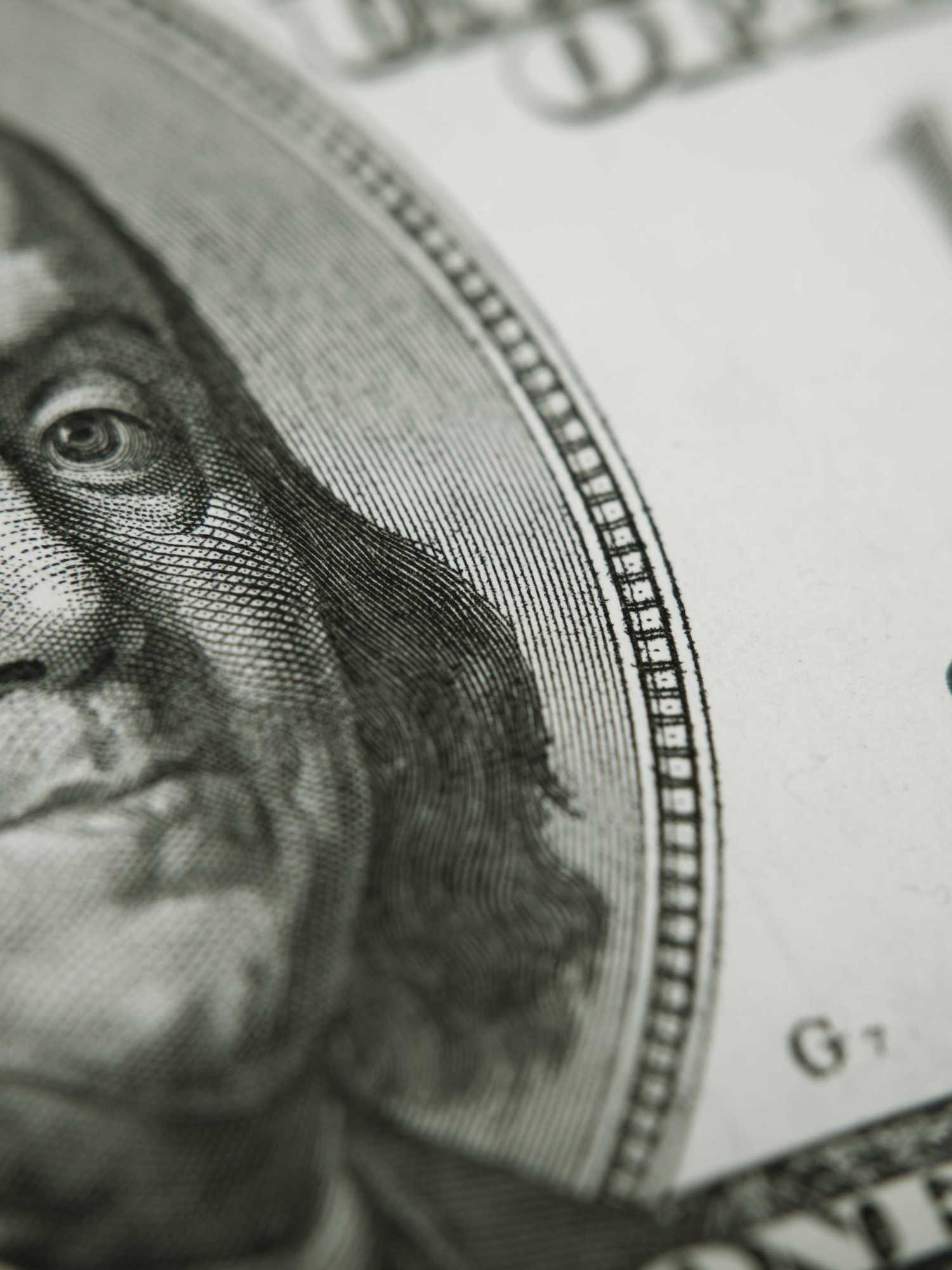 A closeup of a Benjamin Franklin $100 bill.