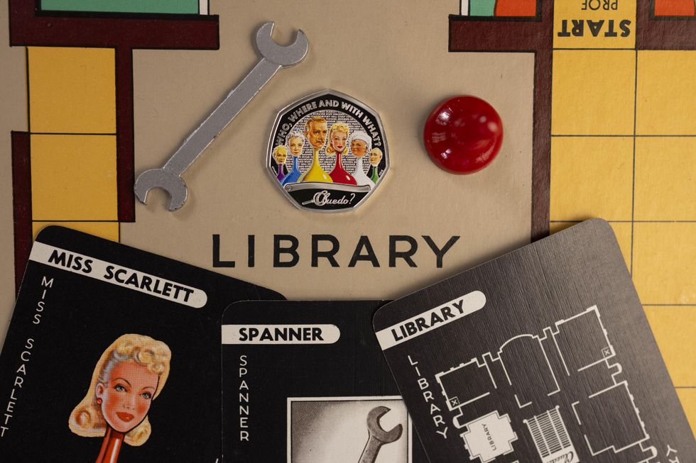 A Cluedo coin and board