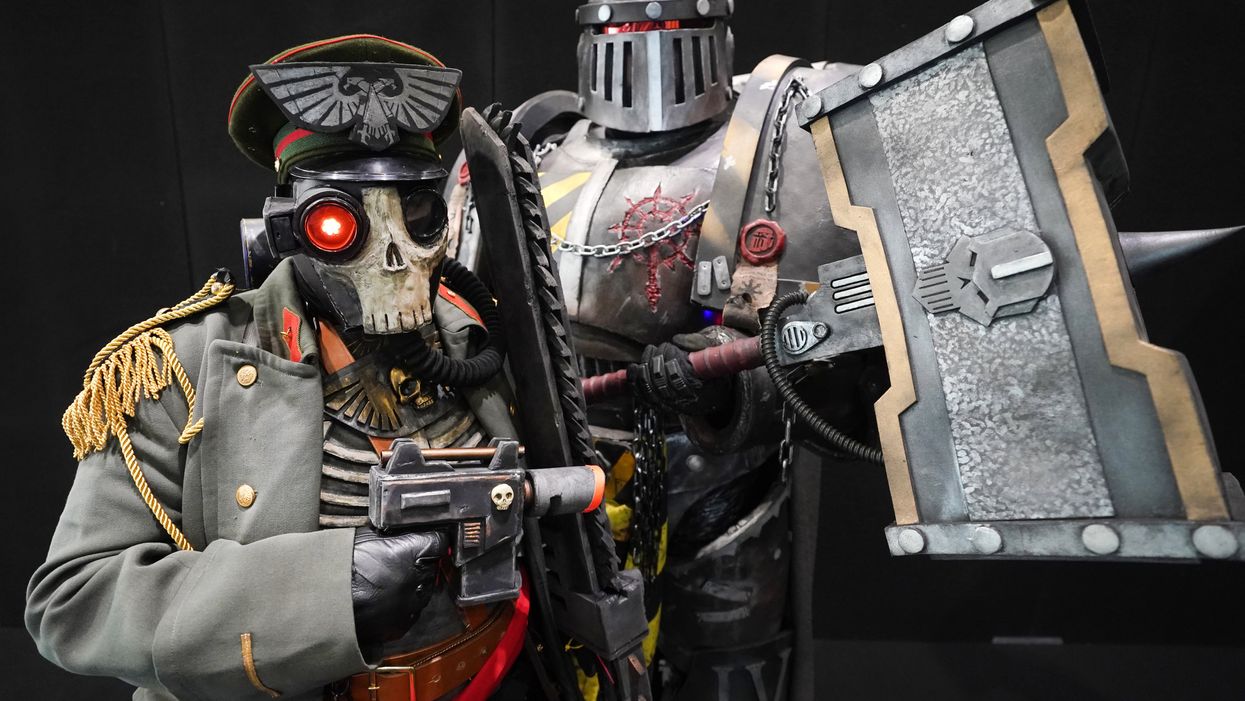 A couple during the first day of MCM Comic Con at the ExCel London (Ian West/PA)