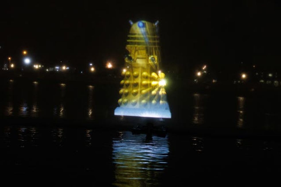 A Dalek is projected in Cardiff Bay