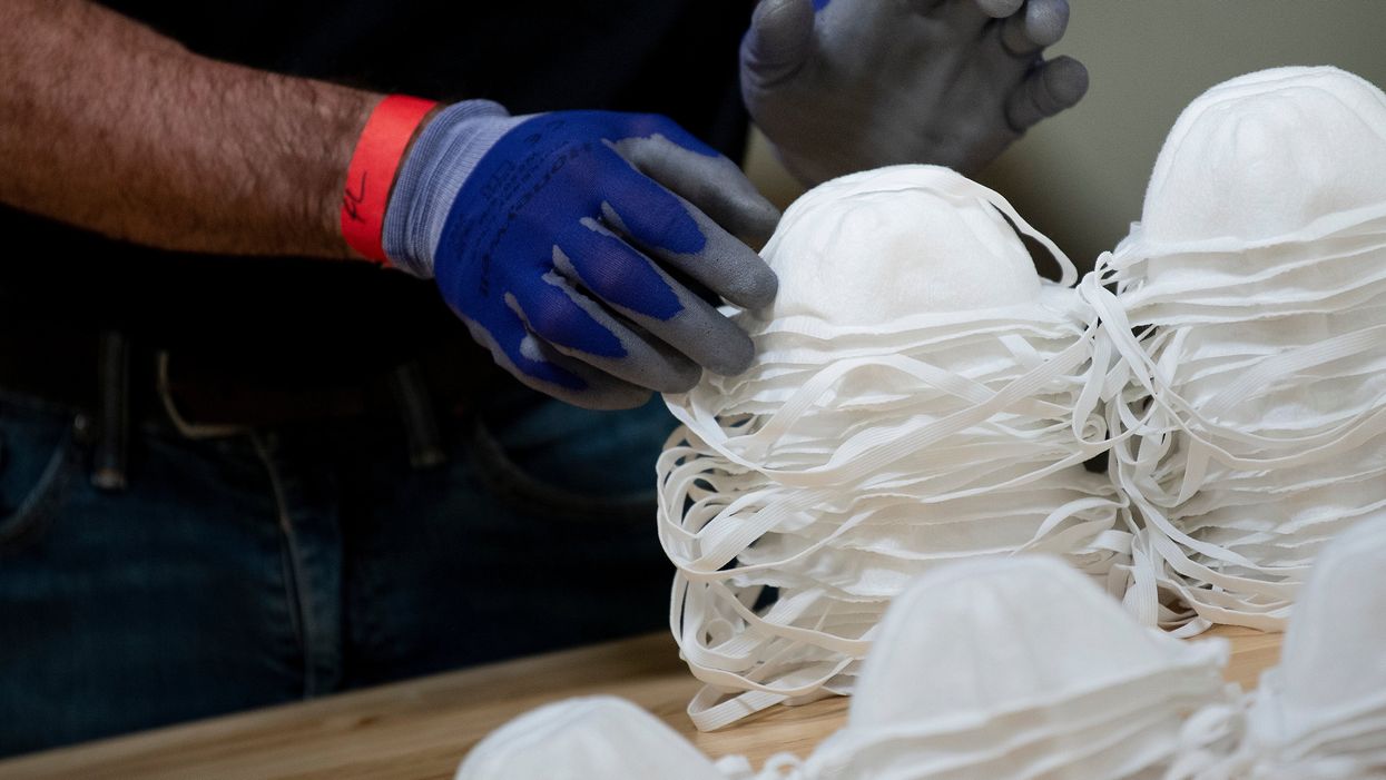 <p>A factory worker producing face masks in America.</p>