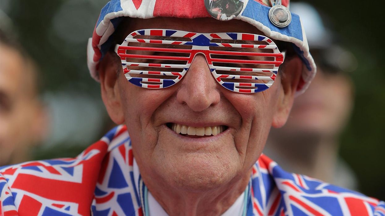 A fan is decked out in the Union Jack as he spectates at the finish of stage three of the 2014 Le Tour de France from Cambridge to London on 7 July 2014 in London, United Kingdom