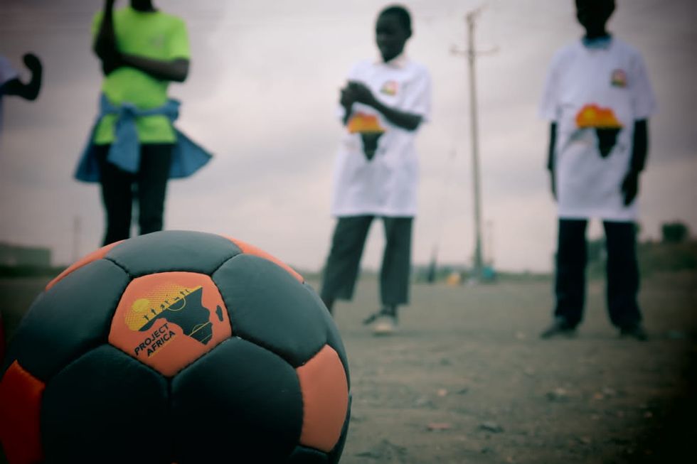 A football with the logo for Project Africa