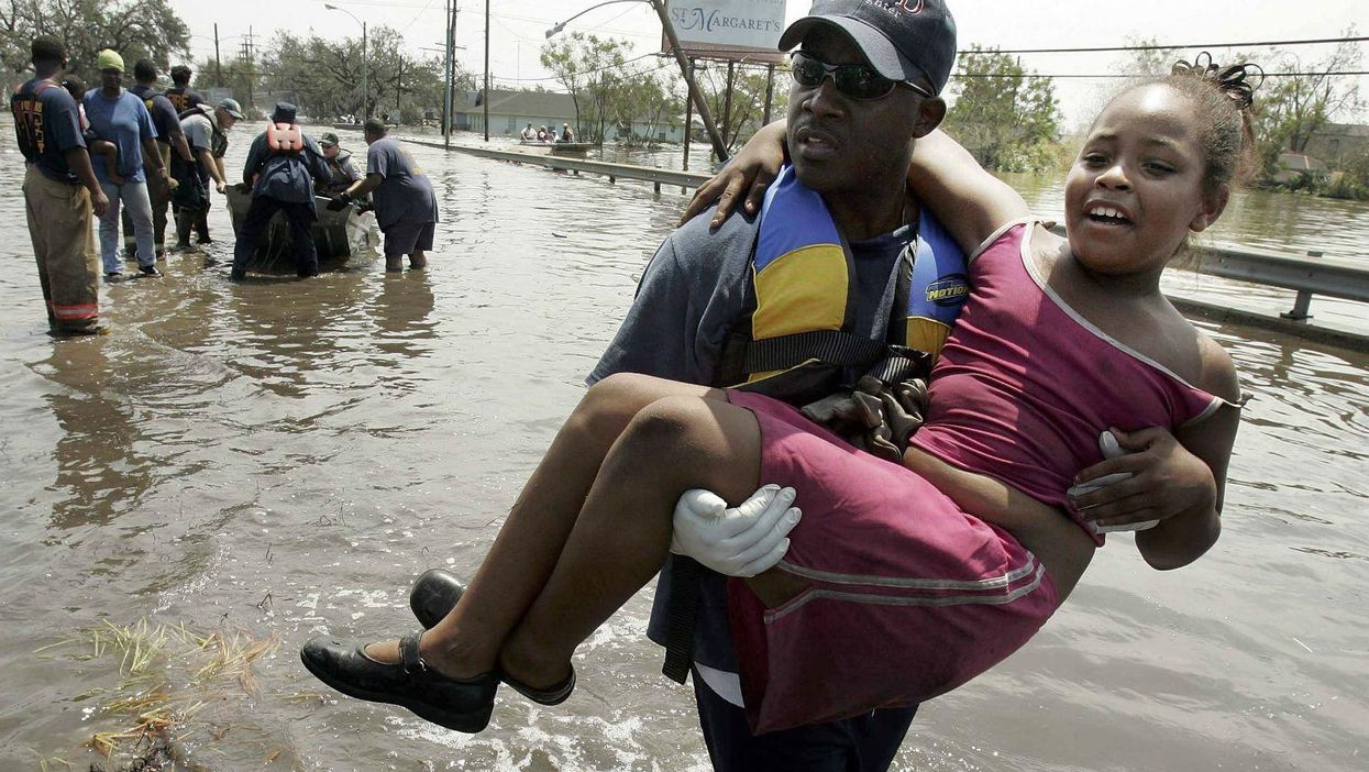 A girl is rescued in New Orleans after Hurricane Katrina