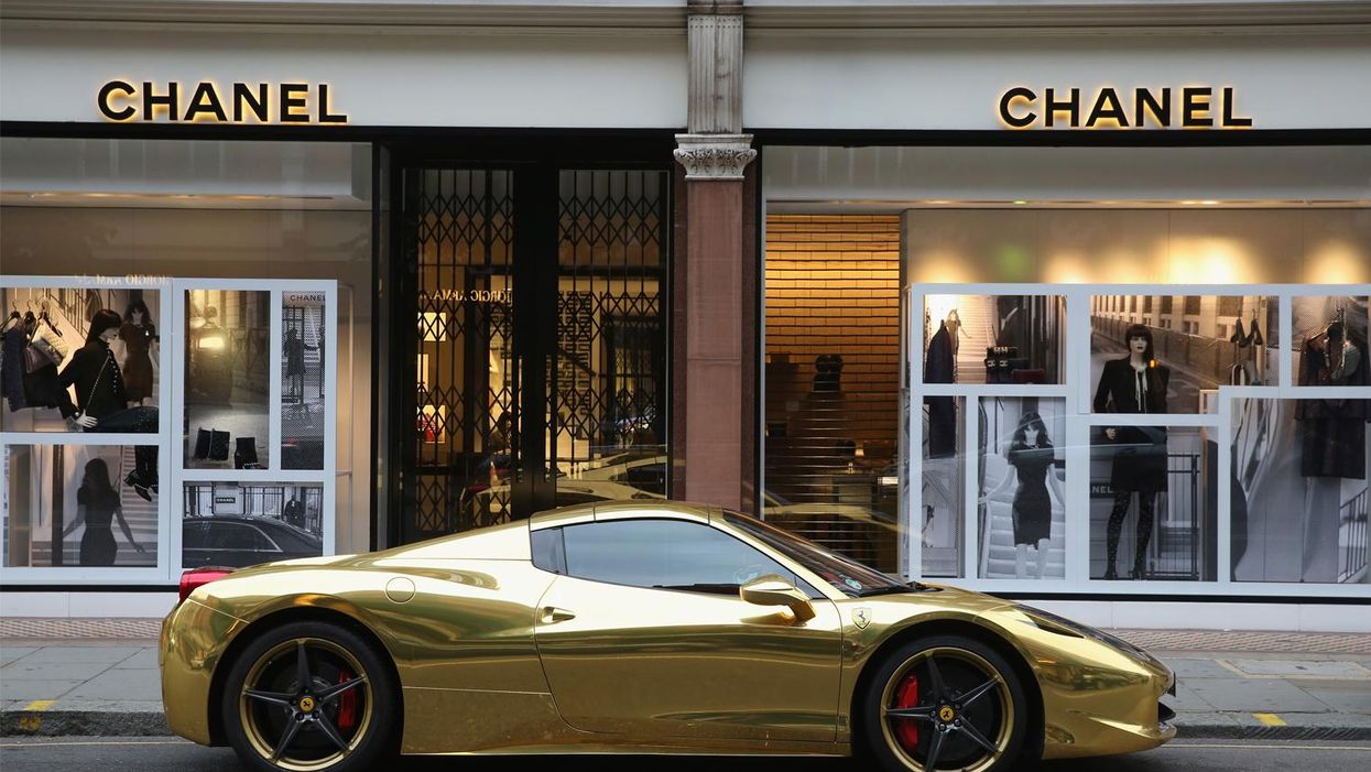 A Gold Ferrari sits outside Chanel on Sloane Street on 8 August 2014 in London