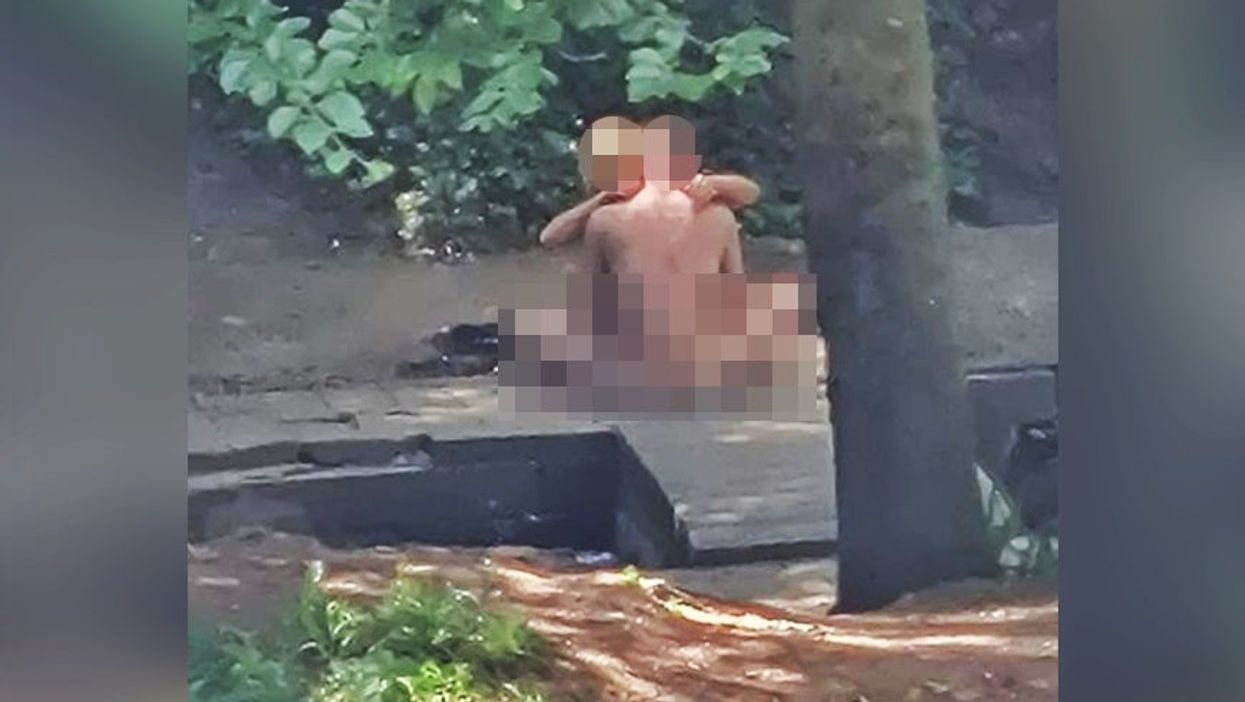 <p>A (heavily pixellated) photograph of the law-breaking couple in question</p>