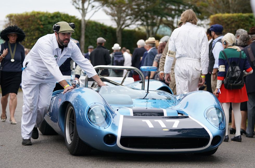 A Lola-Chevrolet T70 Spyder is pushed towards the assembly area (Andrew Matthews/PA)