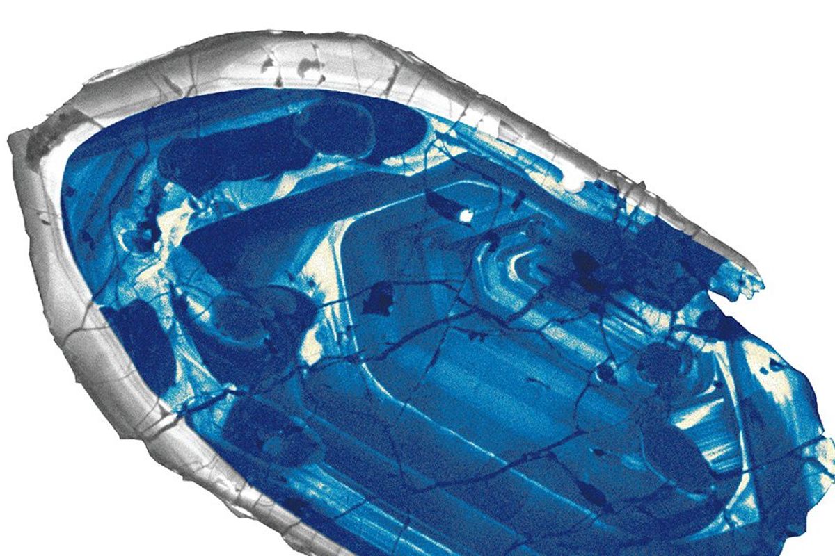 A look into what the oldest zircon ever found could look like. It is an uneven blue stone with silver edges