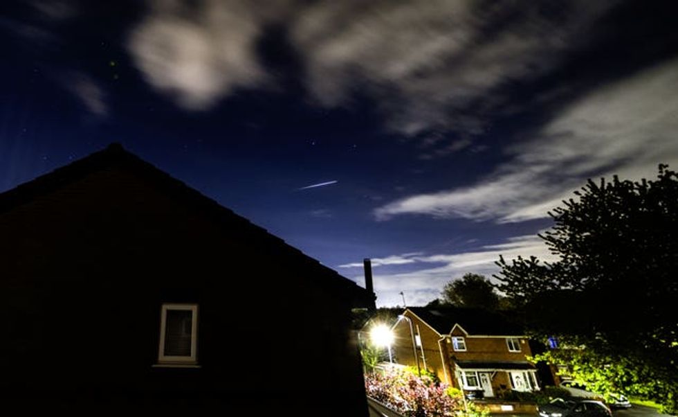 A Lyrid meteor is seen in the sky above Lee Park in Liverpool, Merseyside