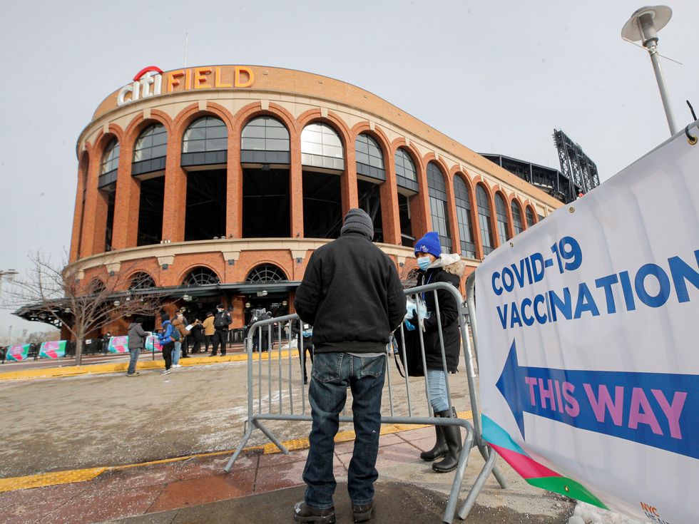 A man arrives to receive the coronavirus disease (COVID-19) vaccine outside Citi Field, the home stadium of MLB's New York Mets in Queens, New York