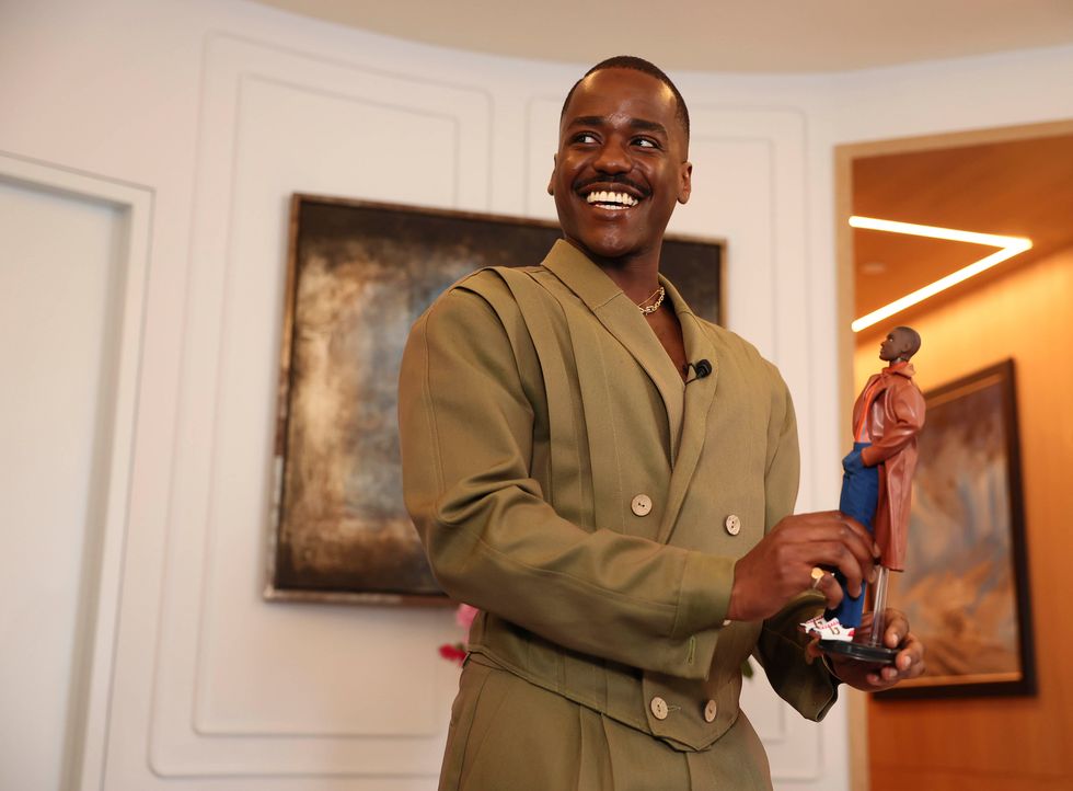 A man holding a doll