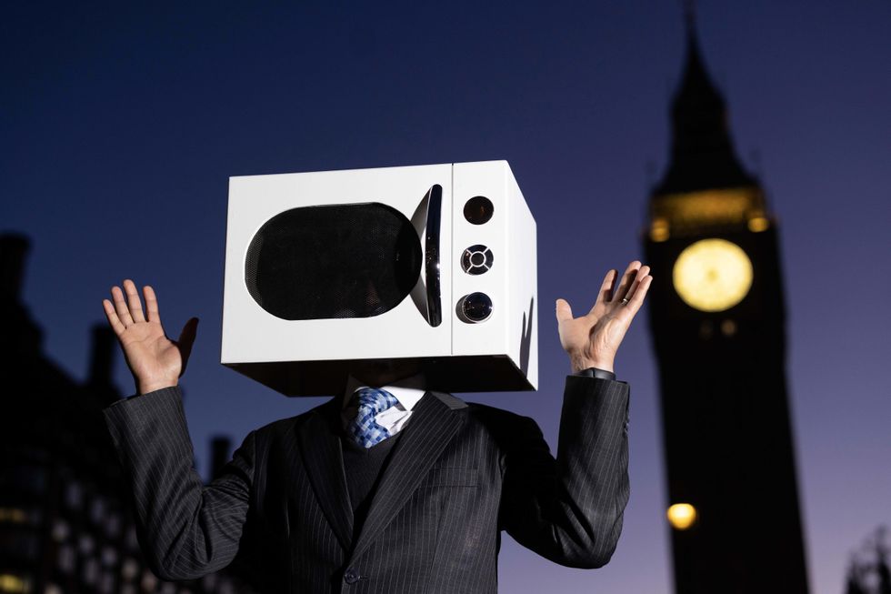 Campaigner with microwave on head to say ‘enough is enough’ to convenience food