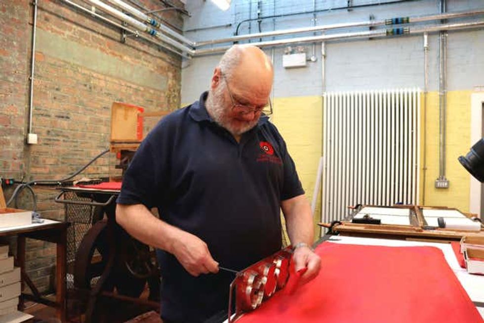 A man making poppies