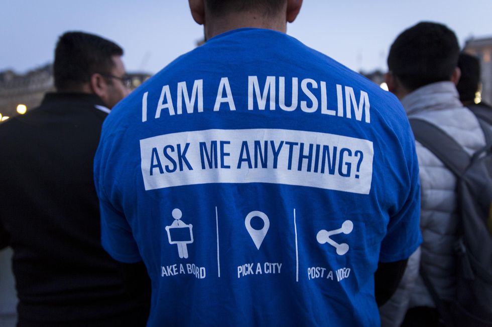 A man pictured during the vigil in 2017 wearing a t-shirt reading: "I am a Muslim. Ask me anything?"