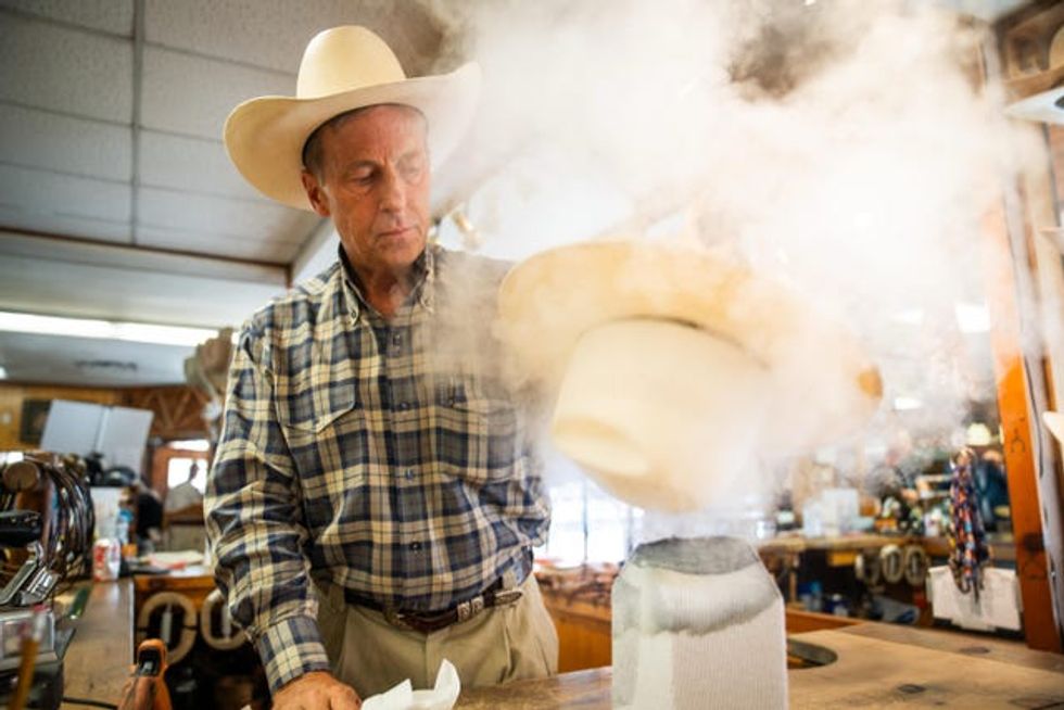 A man shaping a Stetson