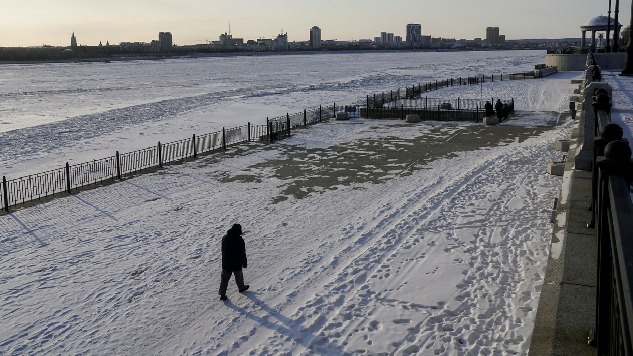 A man walks along an embankment of the Amur river. Picture: