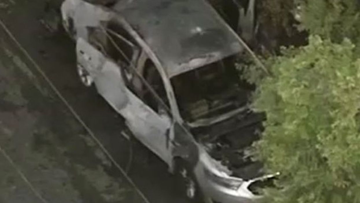 A man was injured after a firebomb was thrown into his car while he was inside