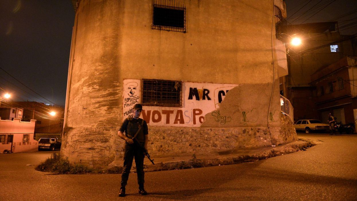 A member of the National Guard takes part in a security operation in Caracas on 13 May 2013