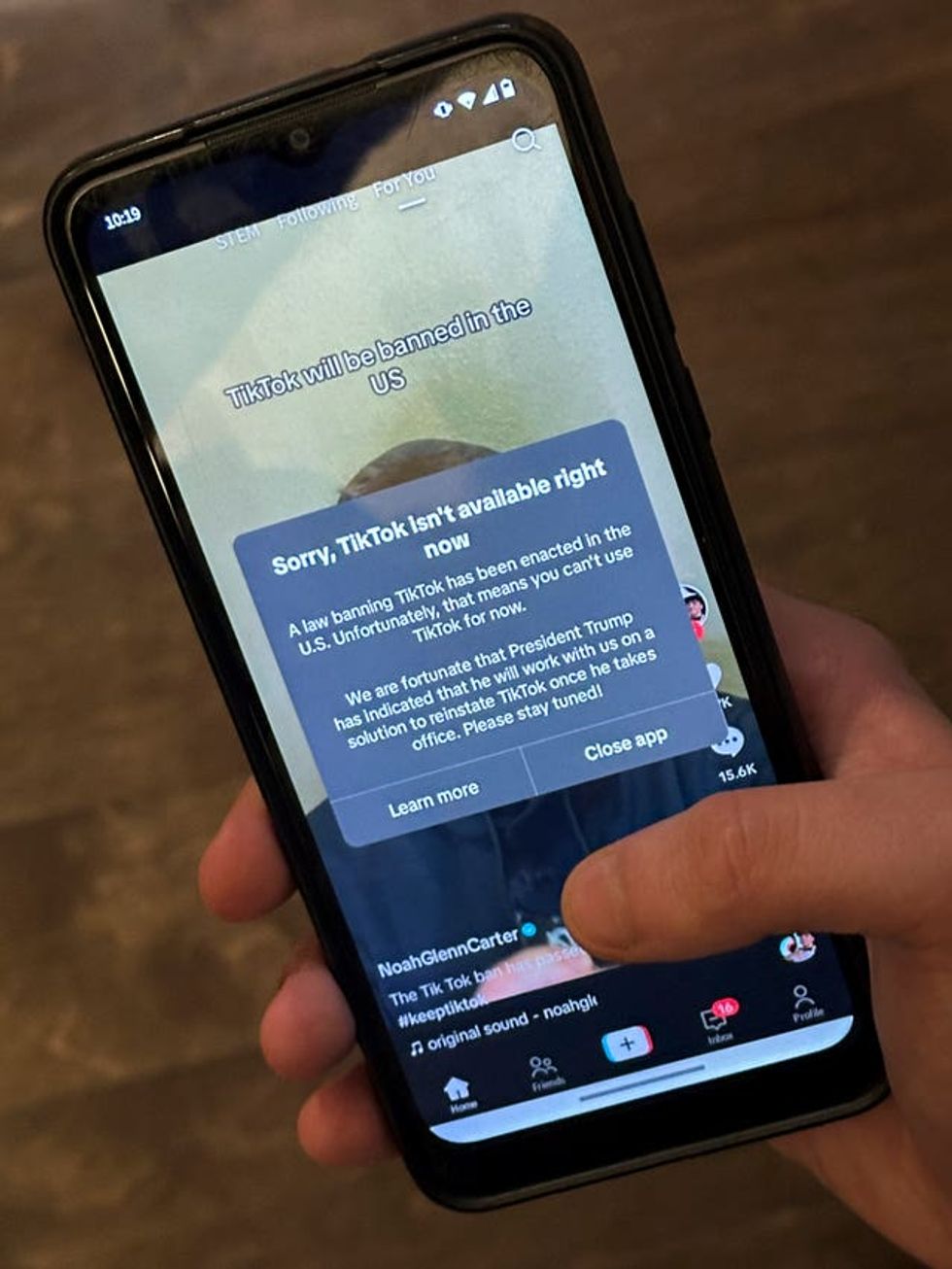 A message reading 'Sorry, TikTok isn\u2019t available right now' is displayed from the TikTok app on a mobile phone screen