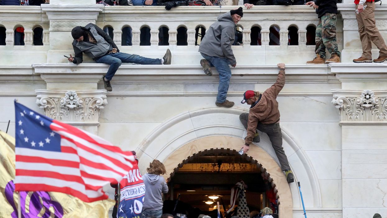 <p>A mob of Trump supporters of storm the US Capitol Building in Washington, DC, on 6 January 2021</p>