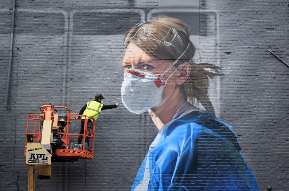 A mural in Manchester of one of the Hold Still photographs