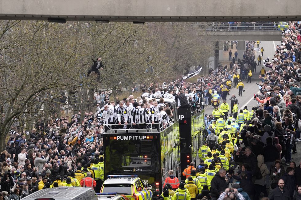 In Pictures: Newcastle fans line streets – and one climbs a tree – at cup parade
