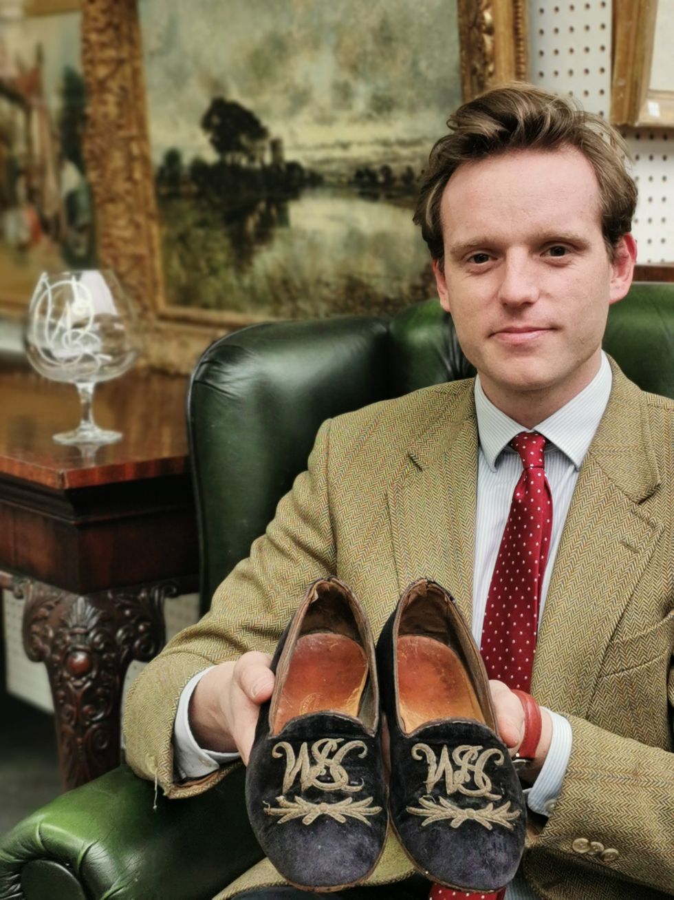 A pair of Winston Churchill\u2019s velvet slippers and brandy glass which have been sold at auction