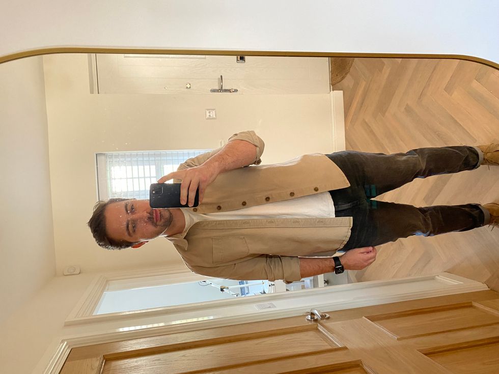 A photo of Ben Beska standing in front of a mirror