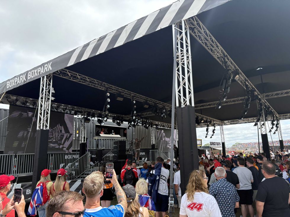 A photo of Professor Green performing on the BOXPARK main stage at the British F1 GP