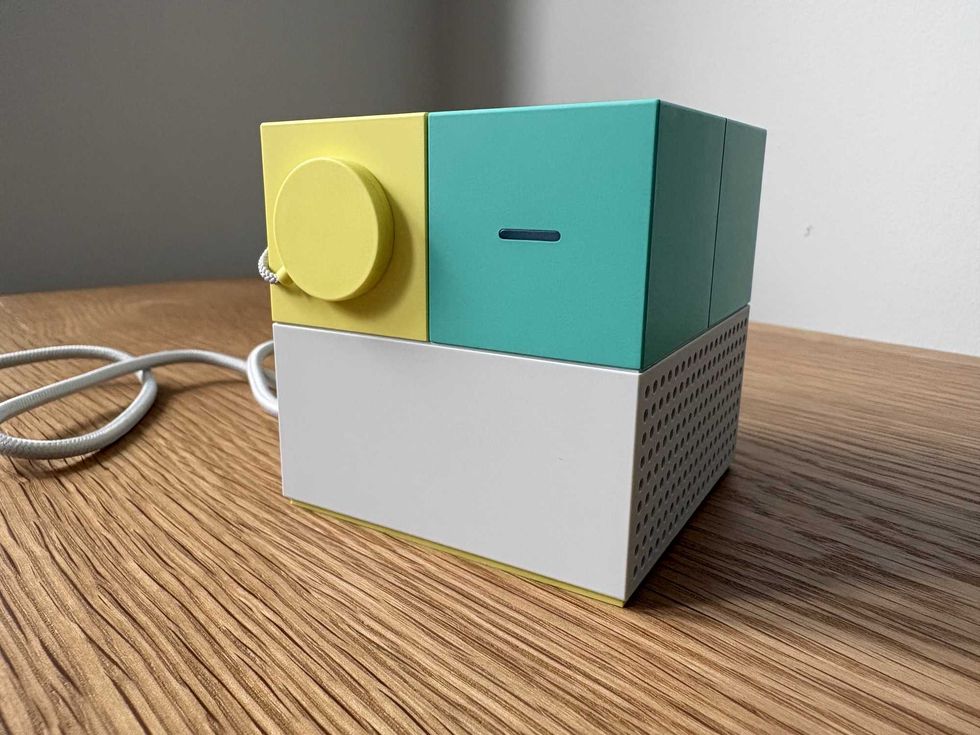 A photo of the Nex Playground console with the lens cap on