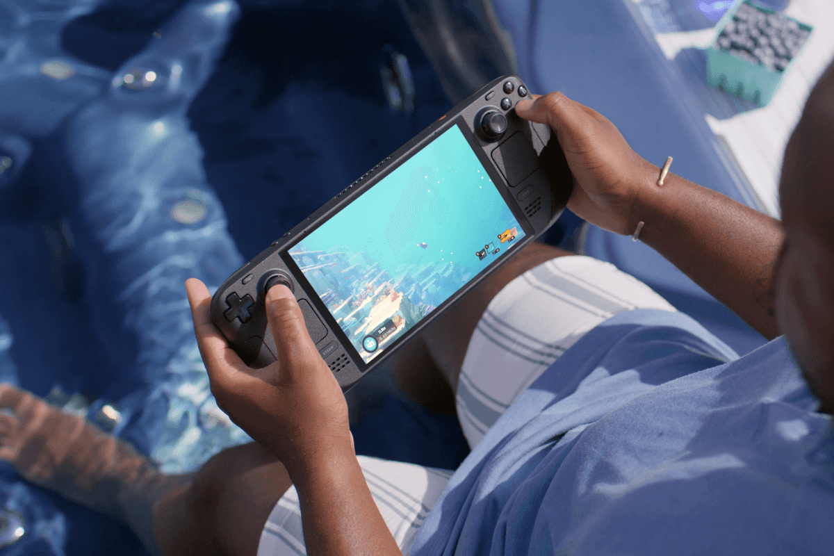 A photograph of someone playing Dave the Diver on a Steam Deck OLED system