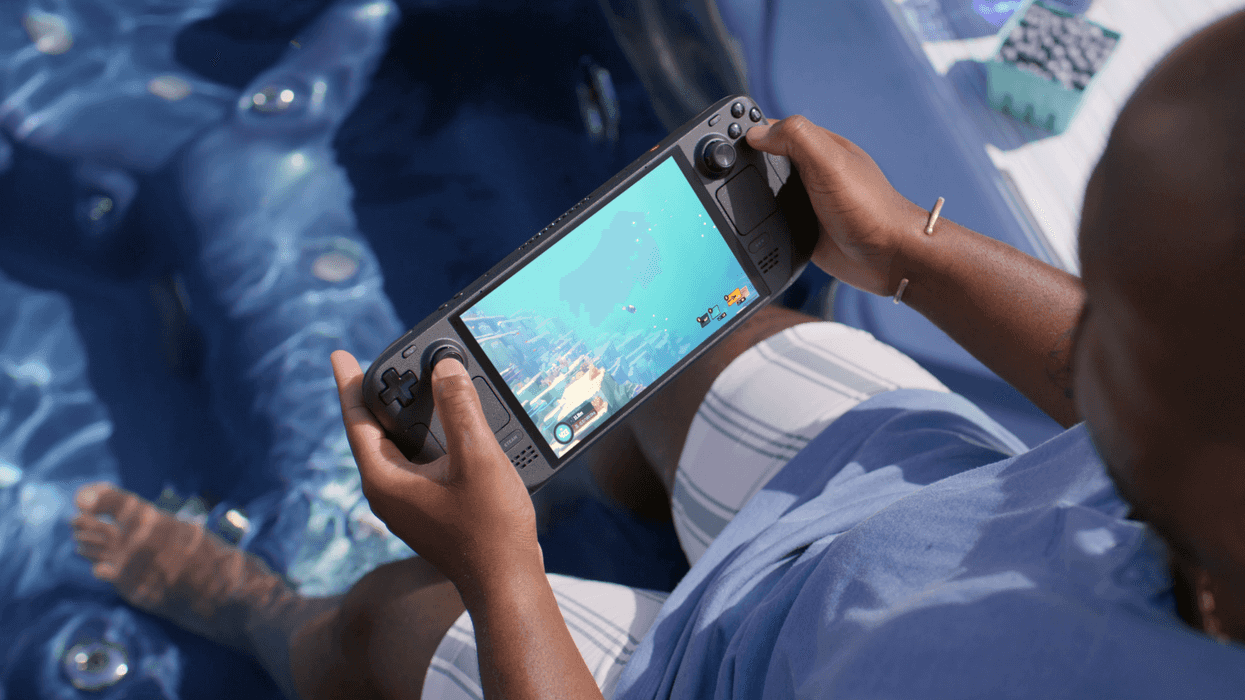 A photograph of someone playing Dave the Diver on a Steam Deck OLED system