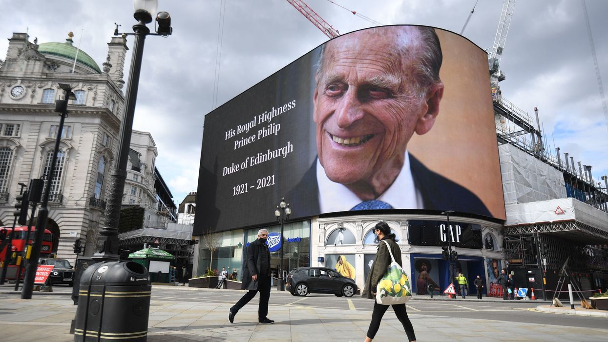 <p>A picture of the Duke of Edinburgh on the screen at Piccadilly Circus</p>