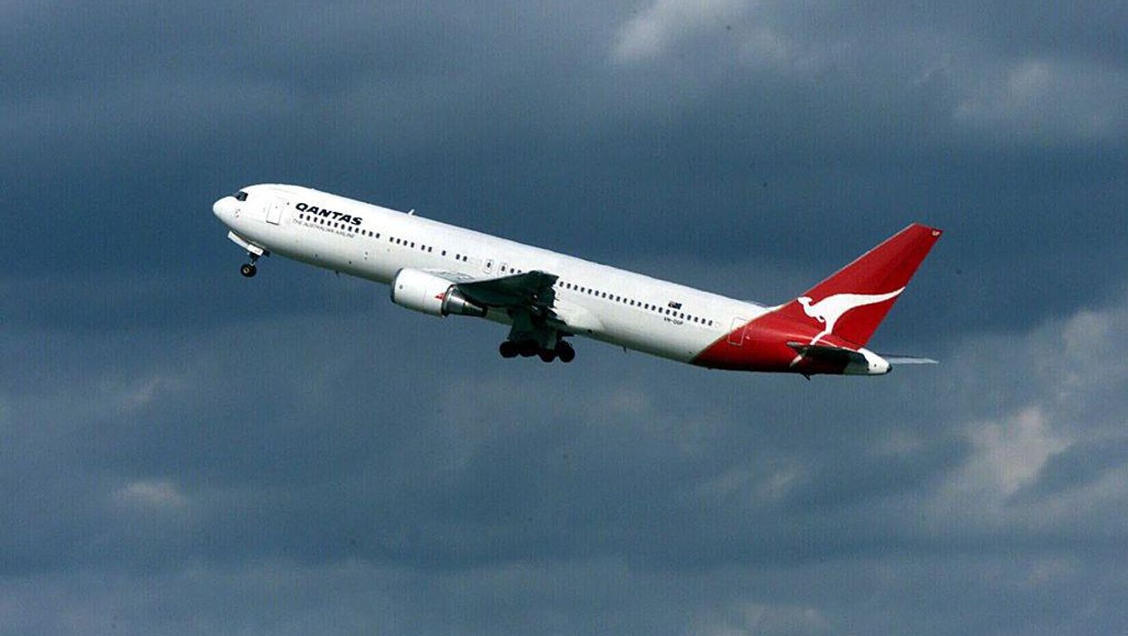 A Qantas Australia 767 jet takes off for Wellington at Auckland Airport