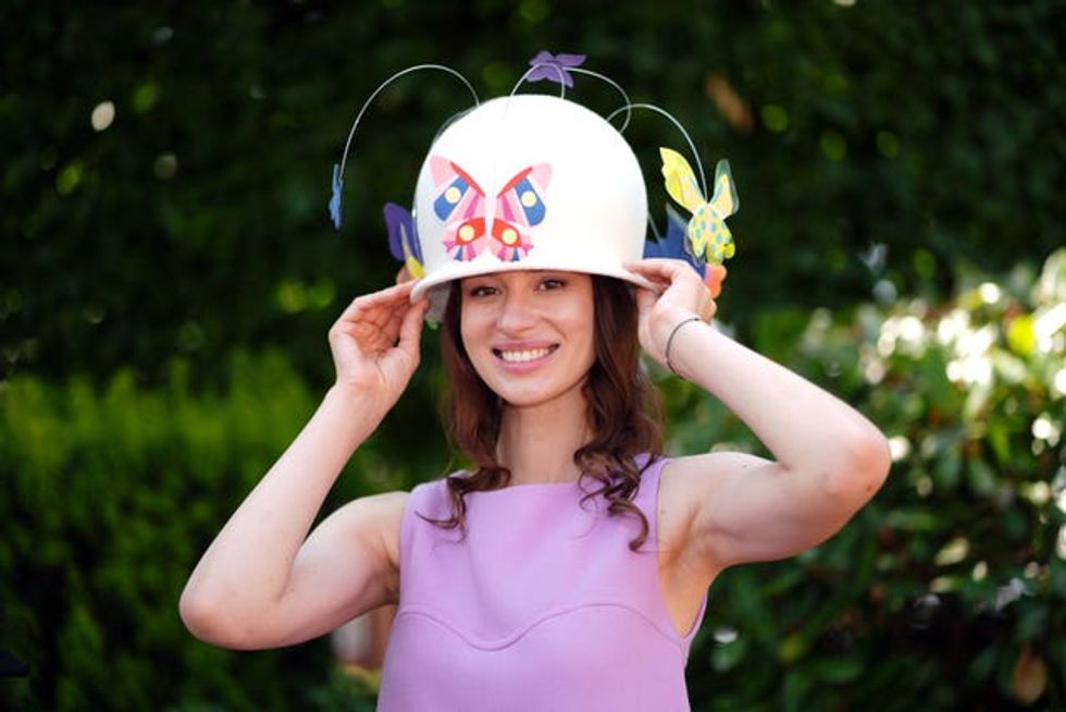 A racegoer modelling an Odette and Elliott hat created for fashion designer Francini Keiser