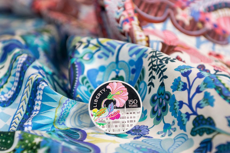 A Royal Mint coin on fabric