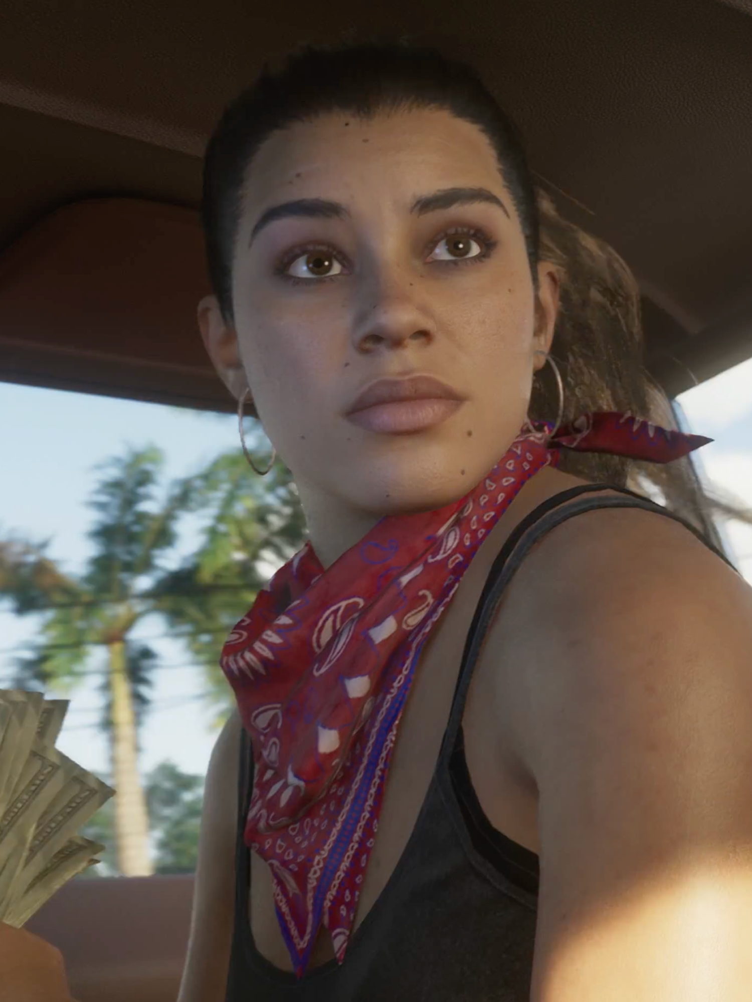 A screenshot from the GTA 6 trailer of Lucia holding cash