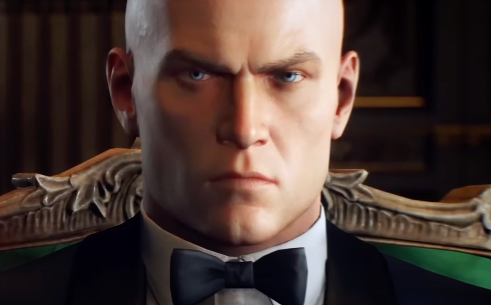 A screenshot of Agent 47 from a Hitman World of Assassination trailer