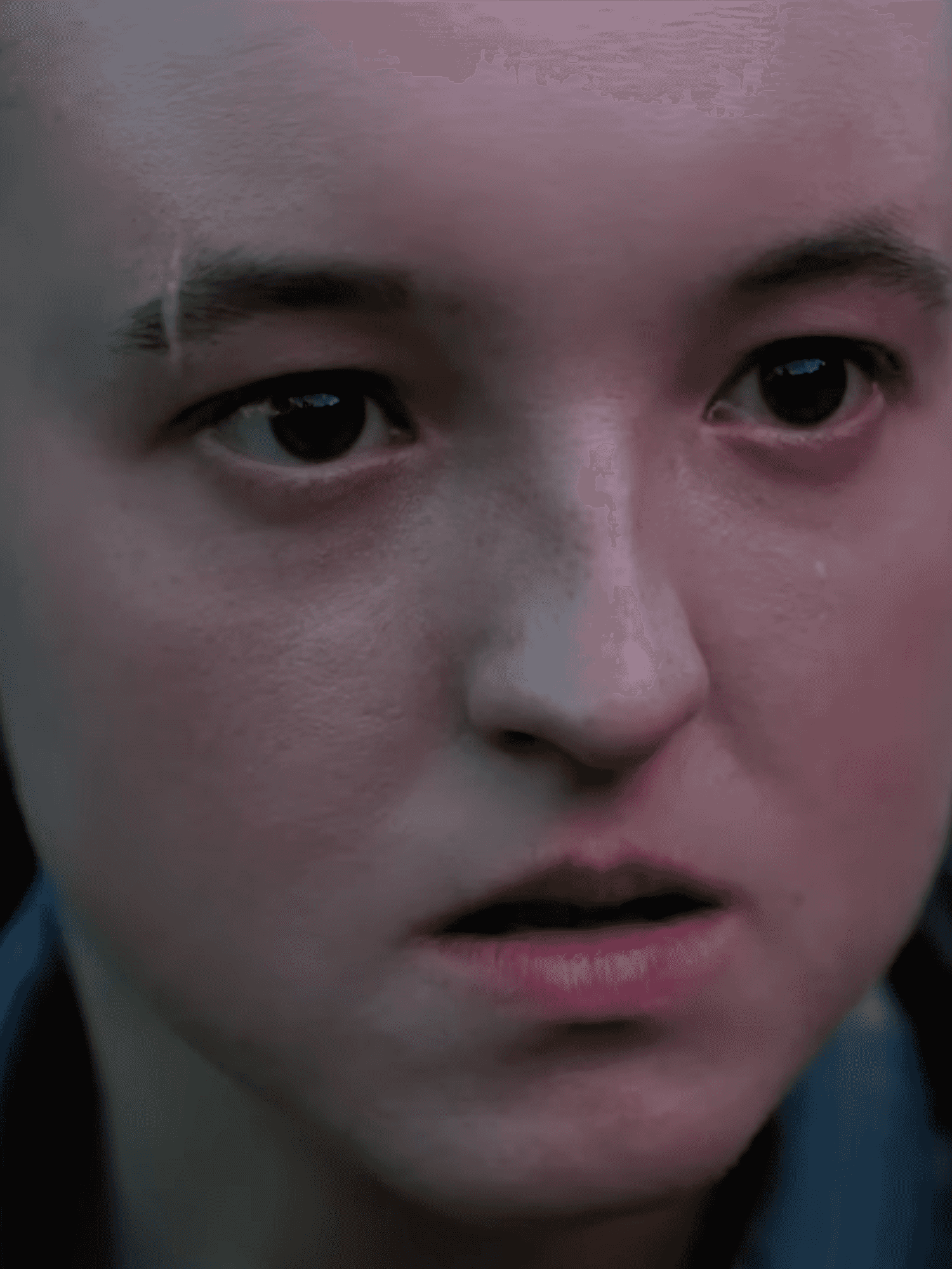 A screenshot of Bella Ramsey as Ellie in The Last of Us HBO adaptation